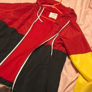 Red, yellow, and black color block windbreaker